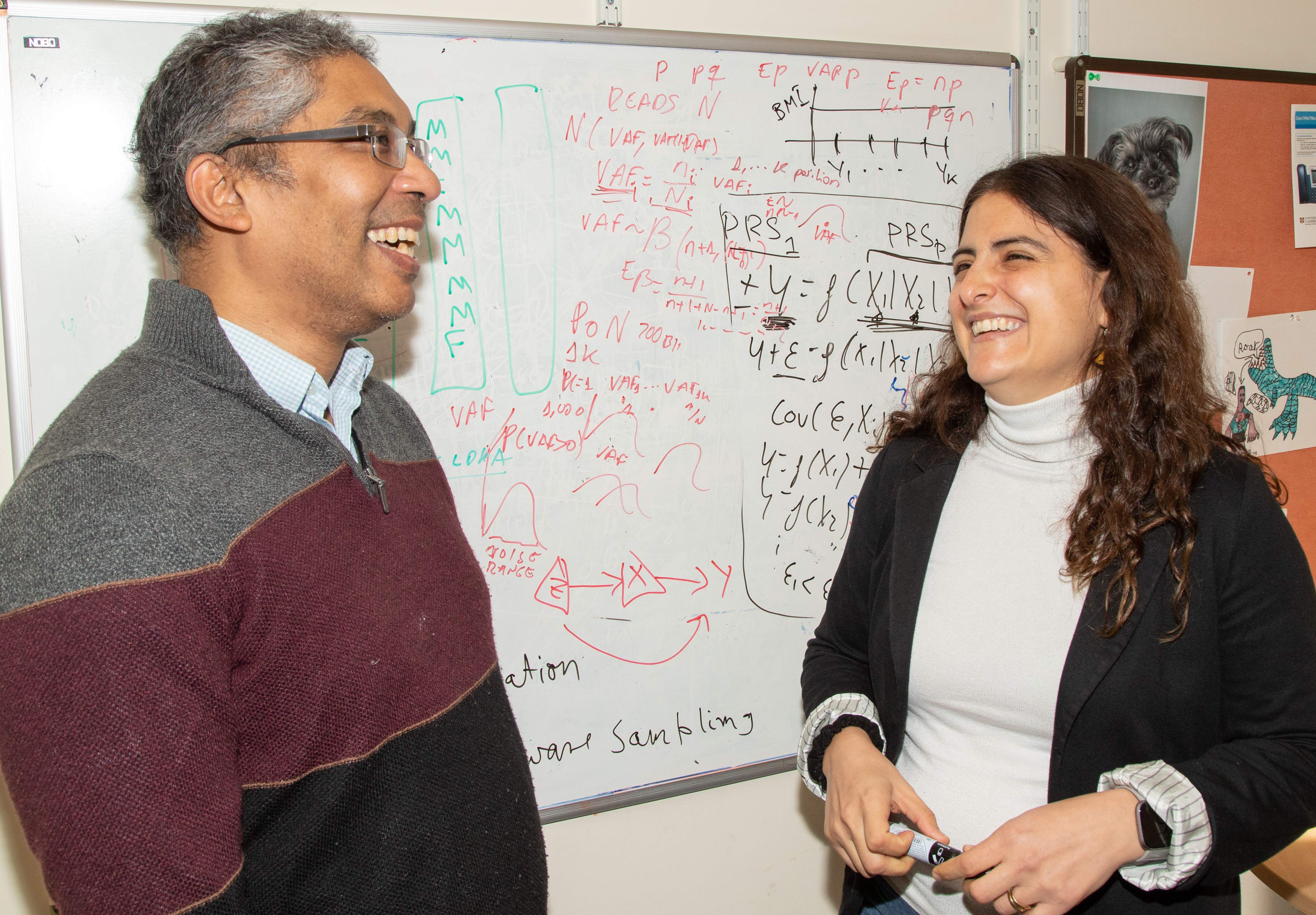 Photo of two BSU staff members discussing research